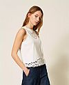 Top with inlaid embroidery
