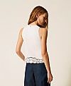 Top with inlaid embroidery