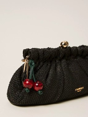 Raffia clutch with charm