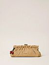 Raffia clutch with charm