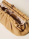 Raffia clutch with charm